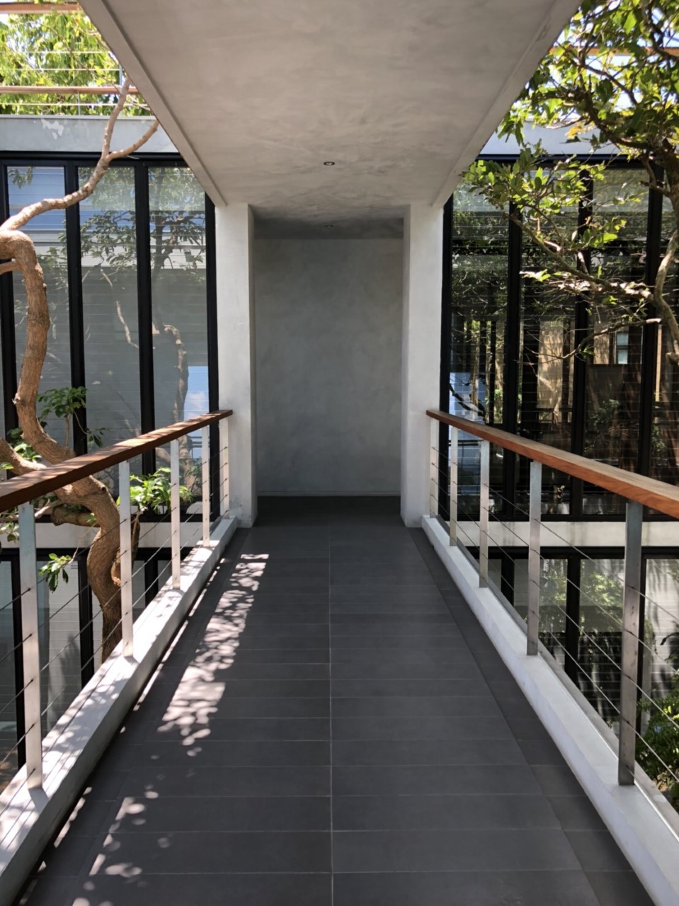 Connecting walkway between two parts of the home with Breezway Louvres either side